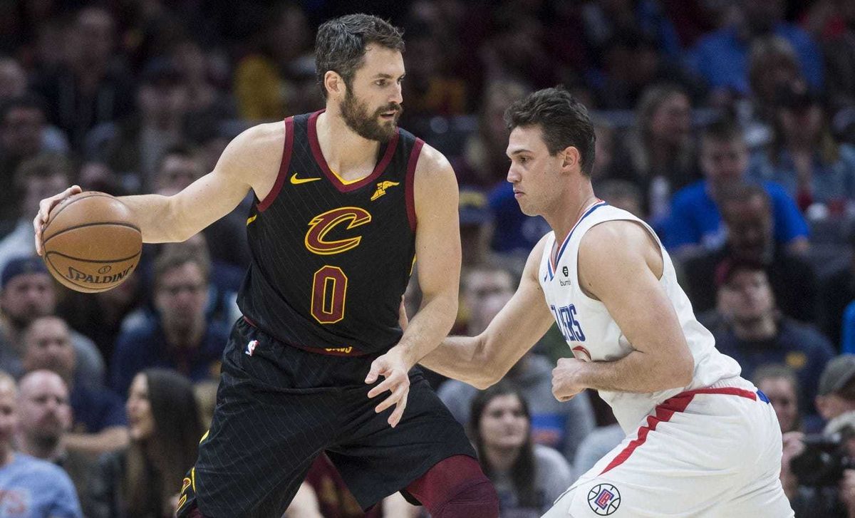 Mar 22, 2019; Cleveland, OH, USA; Los Angeles Clippers forward Danilo Gallinari (8) defends Cleveland Cavaliers forward Kevin Love (0) during the first half at Quicken Loans Arena. Mandatory Credit: Ken Blaze-USA TODAY Sports
