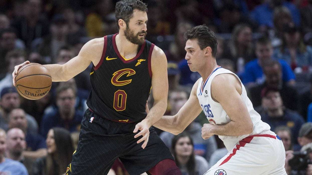 Mar 22, 2019; Cleveland, OH, USA; Los Angeles Clippers forward Danilo Gallinari (8) defends Cleveland Cavaliers forward Kevin Love (0) during the first half at Quicken Loans Arena. Mandatory Credit: Ken Blaze-USA TODAY Sports