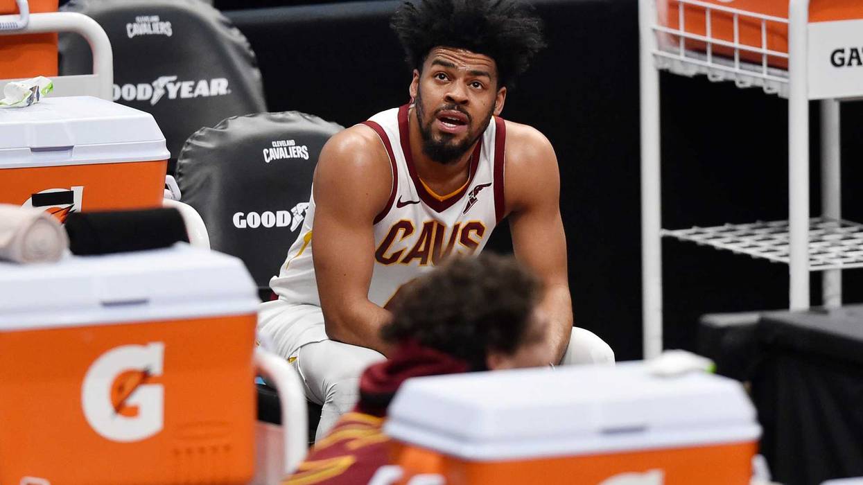 Mar 22, 2021; Cleveland, Ohio, USA; Cleveland Cavaliers guard Quinn Cook (4) reacts on the bench in the fourth quarter against the Sacramento Kings at Rocket Mortgage FieldHouse.