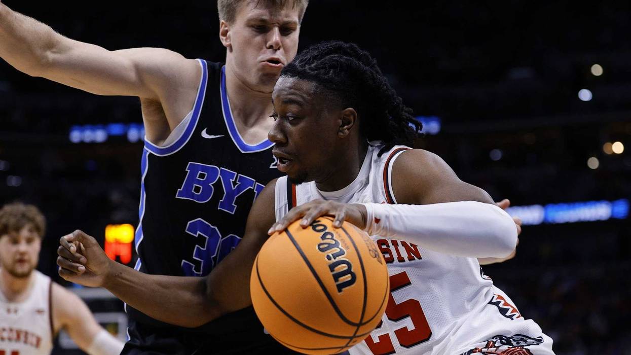 Mar 22, 2025; Denver, CO, USA; Wisconsin Badgers guard John Blackwell (25) dribbles the ball against the Brigham Young Cougars during the first half in the second round of the NCAA Tournament at Ball Arena. Mandatory Credit: Isaiah J. Downing-Imagn Images