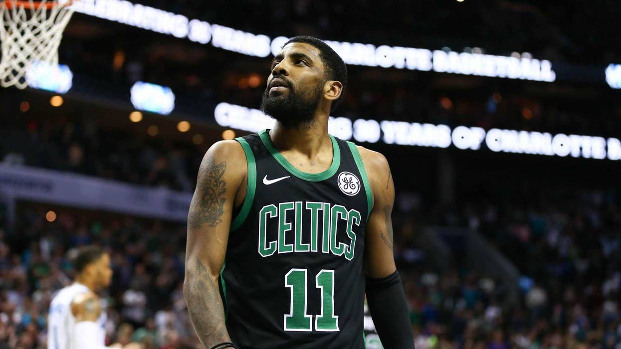 Mar 23, 2019; Charlotte, NC, USA; Boston Celtics guard Kyrie Irving (11) watches a replay after a foul in the second half against the Charlotte Hornets at Spectrum Center. Mandatory Credit: Jeremy Brevard-USA TODAY Sports
