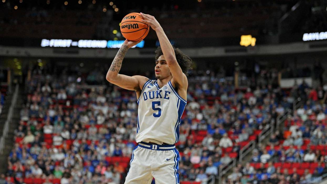 Mar 23, 2025; Raleigh, NC, USA; Duke Blue Devils guard Tyrese Proctor (5) shoots for the basket as Baylor Bears guard Robert Wright III (1) defends during the second half in the second round of the NCAA Tournament at Lenovo Center