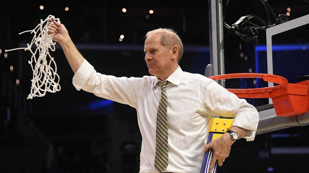 Mar 24, 2018; Los Angeles, CA, USA; Michigan Wolverines head coach John Beilein cuts down the net after defeating the Florida State Seminoles in the championship game of the West regional of the 2018 NCAA Tournament at STAPLES Center. Mandatory Credit: Ri