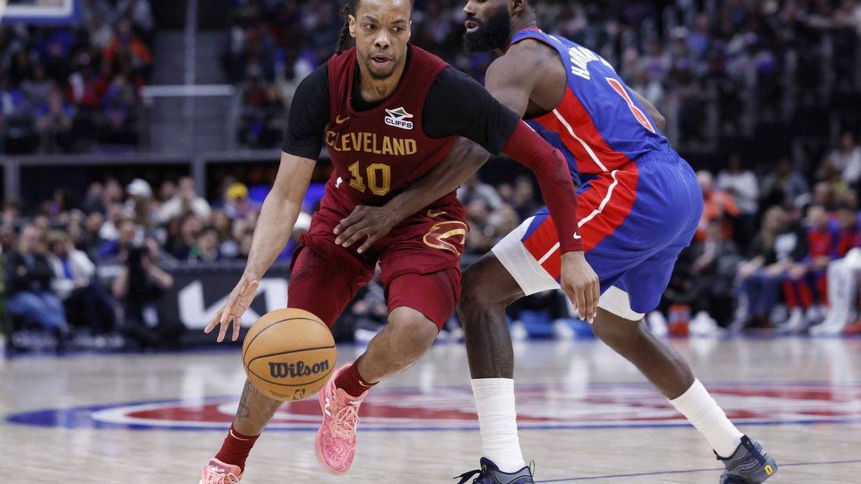Mar 28, 2025; Detroit, Michigan, USA; Cleveland Cavaliers guard Darius Garland (10) dribbles defended by Detroit Pistons forward Tim Hardaway Jr. (8) in the second half at Little Caesars Arena