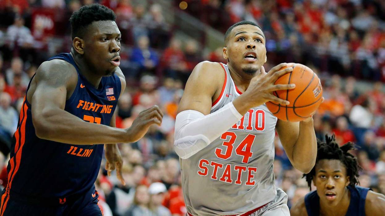 Mar 5, 2020; Columbus, Ohio, USA; Ohio State Buckeyes forward Kaleb Wesson (34) goes in for two past Illinois Fighting Illini center Kofi Cockburn (left)during the second half at Value City Arena.