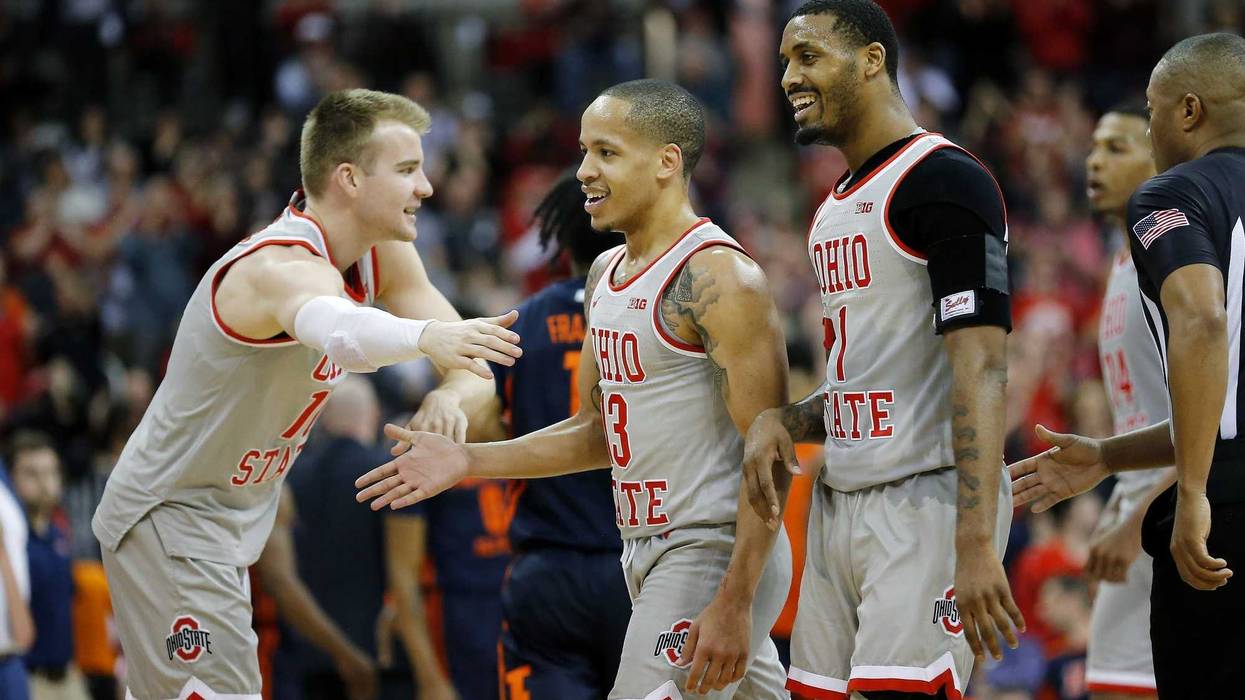 Mar 5, 2020; Columbus, Ohio, USA; Ohio State Buckeyes guard CJ Walker (center) celebrates with guard Luther Muhammad (right) and forward Justin Ahrens (left)as time winds down during the second half against the Illinois Fighting Illini at Value City Arena