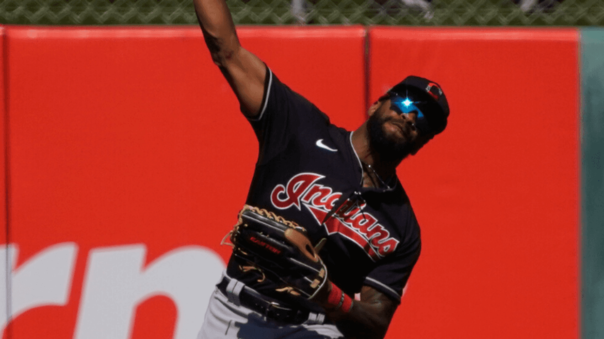 Mar 9, 2020; Tempe, Arizona, USA; Cleveland Indians center fielder Delino DeShields (0) makes the play against the Los Angeles Angels during a spring training game at Tempe Diablo Stadium. Mandatory Credit: Rick Scuteri-USA TODAY Sports