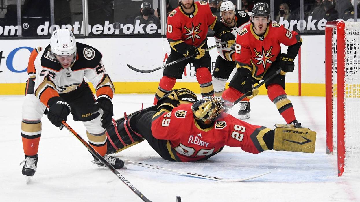 Marc-Andre Fleury #29 of the Vegas Golden Knights flips on his back as he defends the net against Sam Steel #23 of the Anaheim Ducks in the first period of their game at T-Mobile Arena on February 9, 2021 in Las Vegas, Nevada.