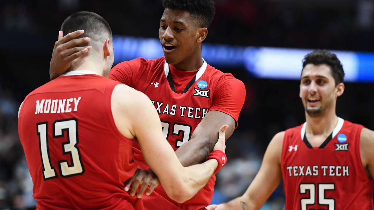March 30, 2019; Anaheim, CA, USA; Texas Tech Red Raiders guard Matt Mooney (13) guard Davide Moretti (25) and guard Jarrett Culver (23) celebrate the victory against Gonzaga Bulldogs in the championship game of the west regional of the 2019 NCAA Tournamen