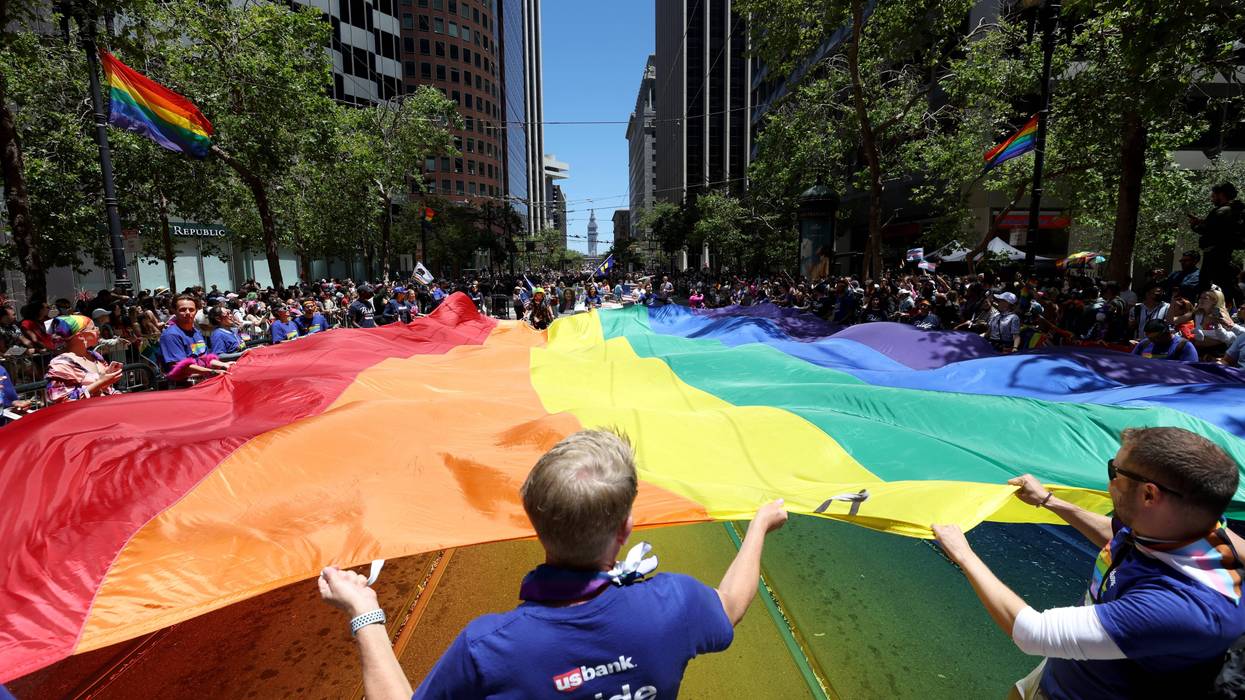 Marchers carry an oversized Pride flag during the 52nd Annual San Francisco Pride Parade and Celebration on June 26, 2022 in San Francisco, California.