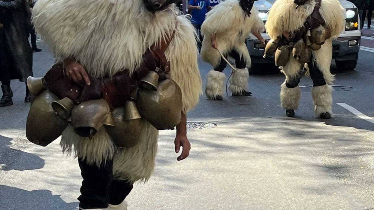 Marchers depict traditional Sardinian Mamuthones from ancient carnivals