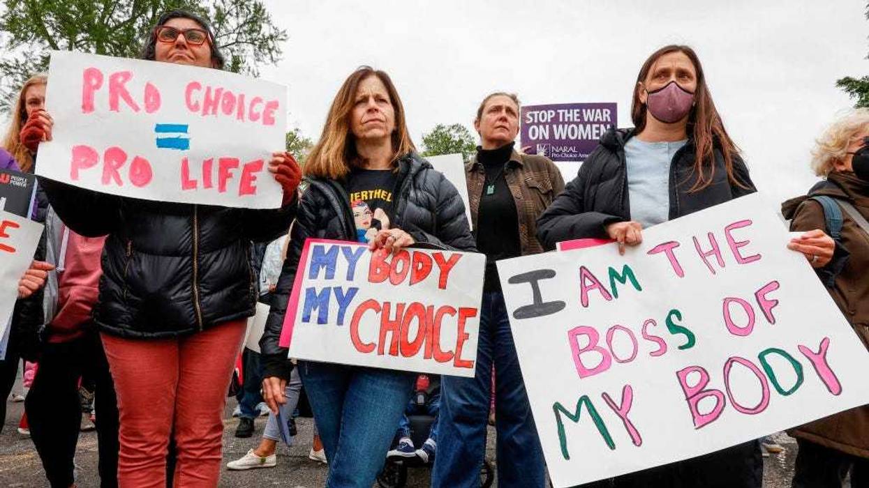 Marchers hold up signs during a Mothers Day rally in support of Abortion rights at the U.S. Supreme Court on May 08, 2022 in Washington, DC.