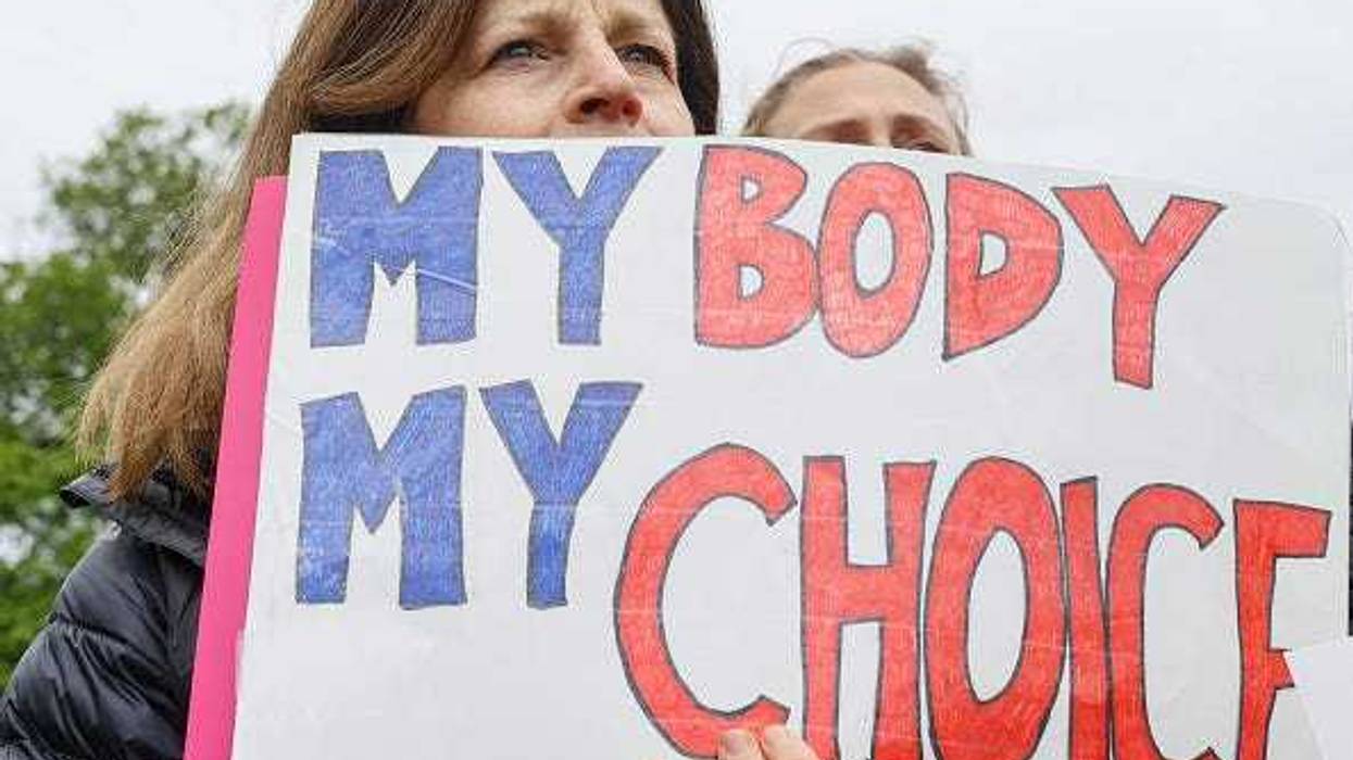Marchers hold up signs during a Mothers Day rally in support of Abortion rights at the U.S. Supreme Court on May 08, 2022 in Washington, DC.