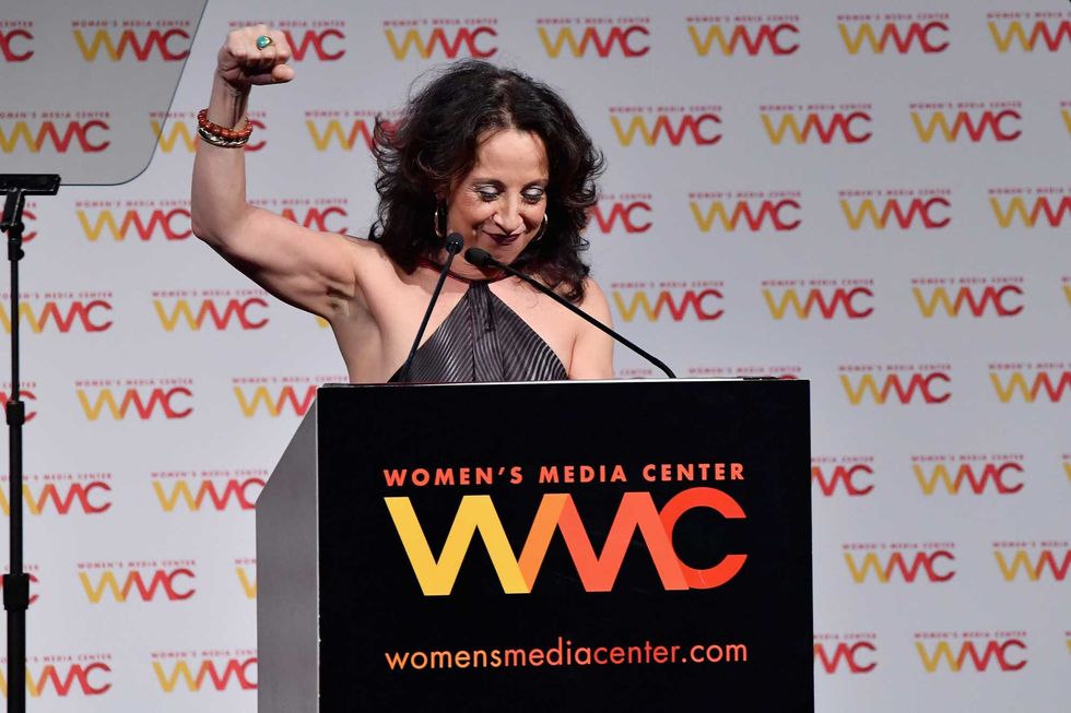 Maria Hinojosa accepts the Carol Jenkins Award onstage at the Women
