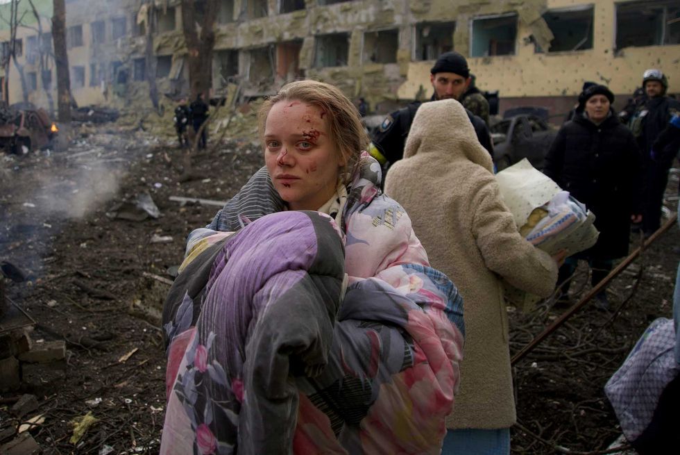 Mariana Vishegirskaya stands outside a maternity hospital that was damaged by shelling in Mariupol, Ukraine, Wednesday, March 9, 2022.