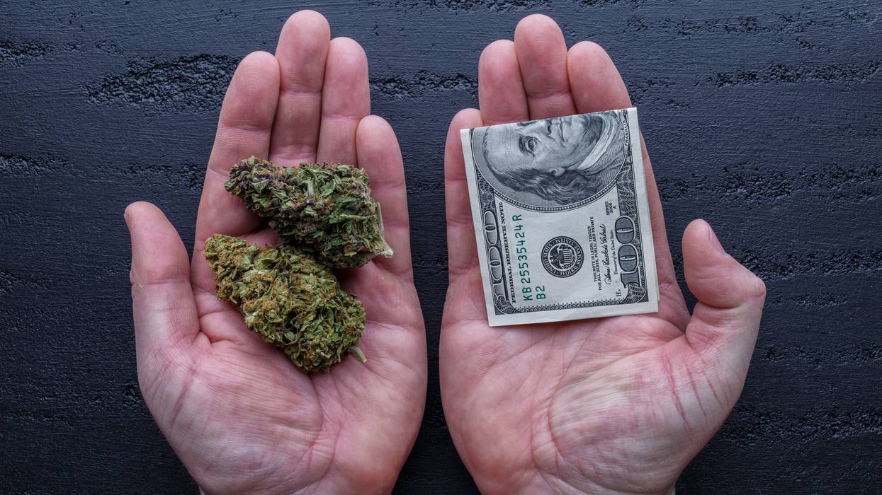 Marijuana and money in hands
