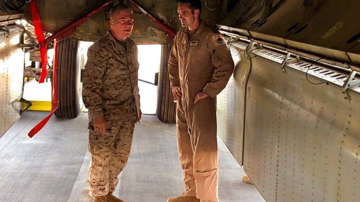 Marine Gen. Frank McKenzie, head of U.S. Central Command, confers with an Air Force officer
