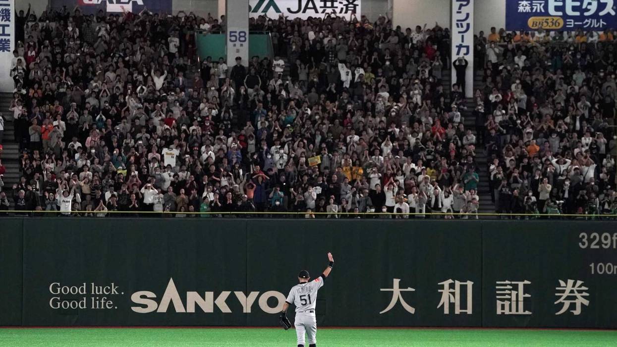 Mariners outfielder Ichiro Suzuki waves to the crowd in Tokyo as he leaves the field for the final time before his retirement.