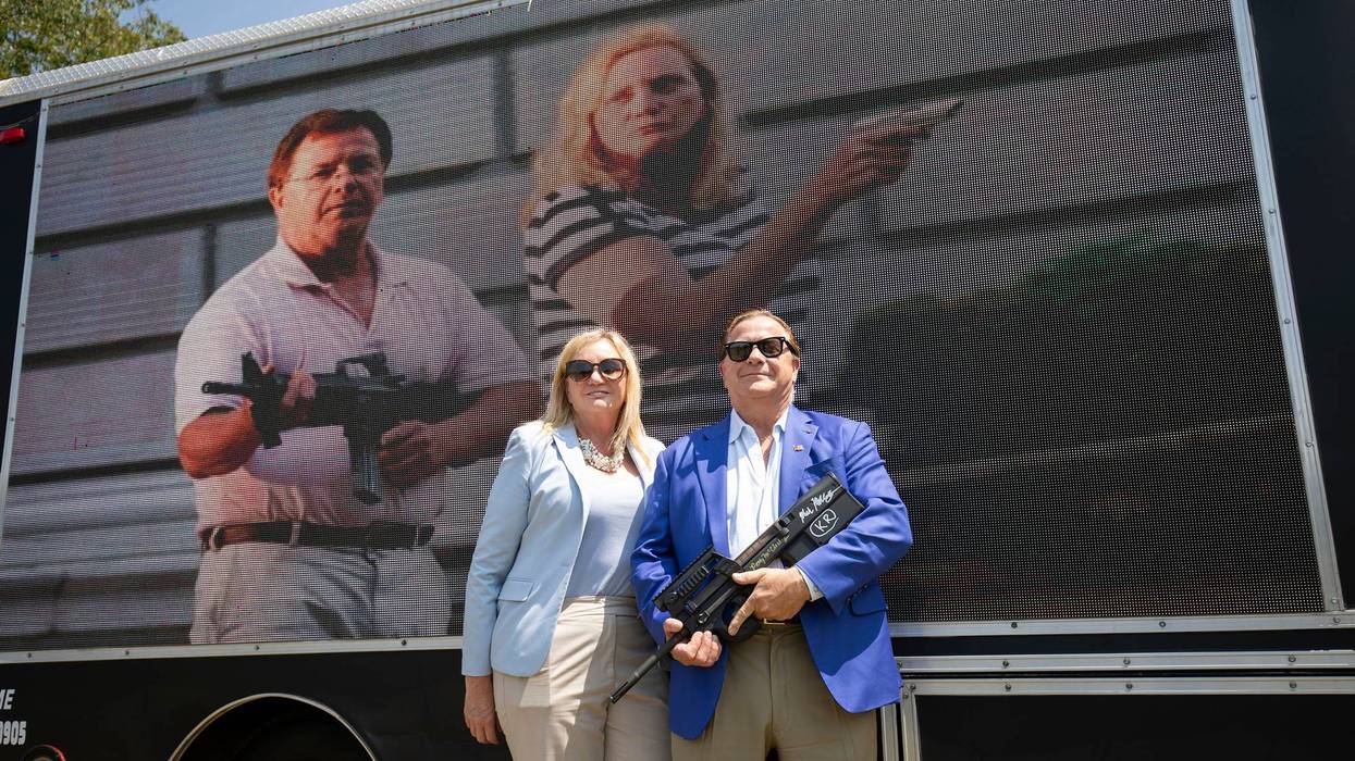 Mark and Patricia McCloskey of St. Louis, Missouri pose for a photo before speaking at a "Defend Our 2A: Michigan's Fight for Self Preservation" rally at a farm on July 19, 2023 in Ionia, Michigan.