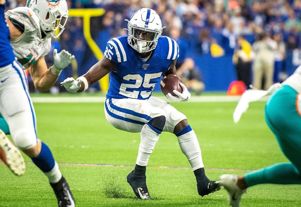 Marlon Mack looks to shed a Dolphins defender in 2019