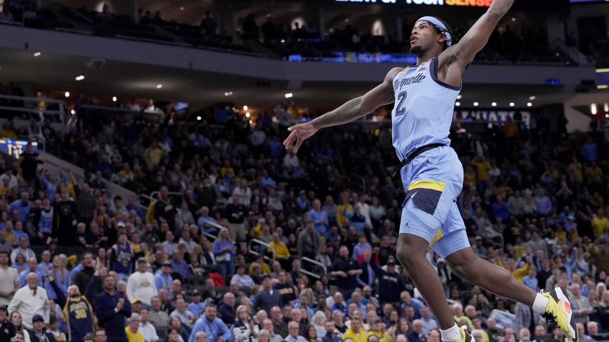 Marquette guard Chase Ross (2) throws down a dunk during the first half of their game against Purdue Tuesday, November 19, 2024 at Fiserv Forum in Milwaukee, Wisconsin.