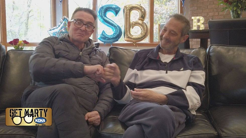 Marty Griffin fist bumps his friend Bruce who