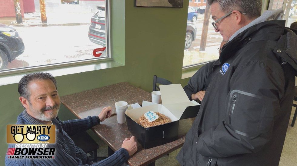 Marty Griffin gets ready to deliver a special cake from Oakmont Bakery.