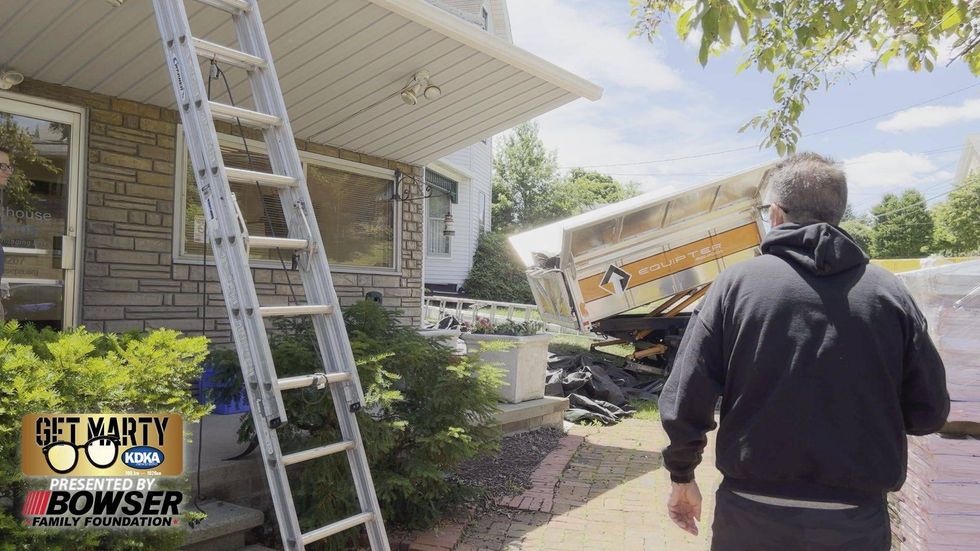 Marty Griffin gets ready to meet the recipient of a new roof from EAS Roofing for the KDKA Radio Warmathon.