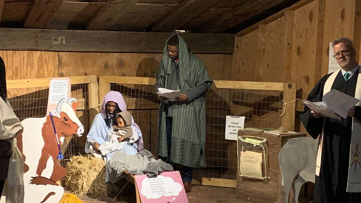 Mary, Joseph, a donkey and more than two dozen carolers took to the streets of Old City Christmas Eve evening, asking neighbors for a place the couple could stay.