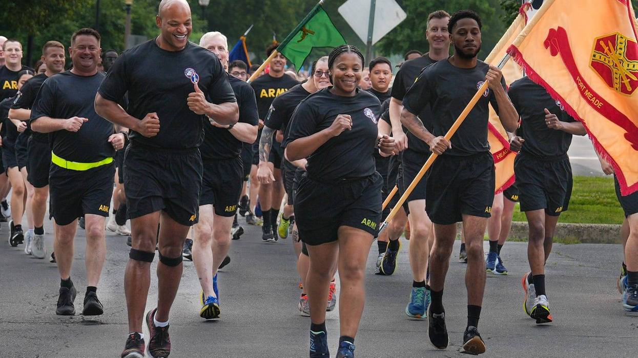 Maryland Governor and Army veteran Wes Moore runs with Fort George G. Meade Garrison Commander Col. Yolanda Gore