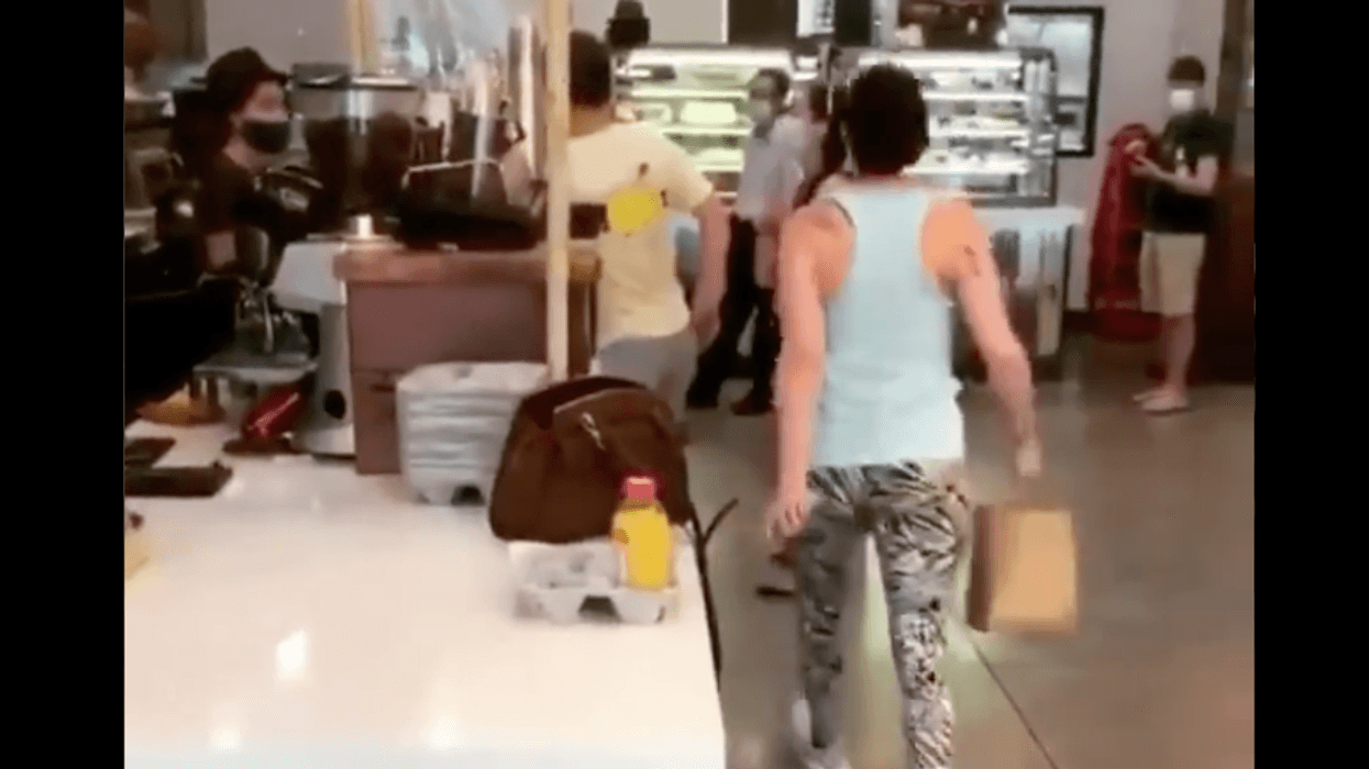 Mask-less woman coughs Queens bagel shop
