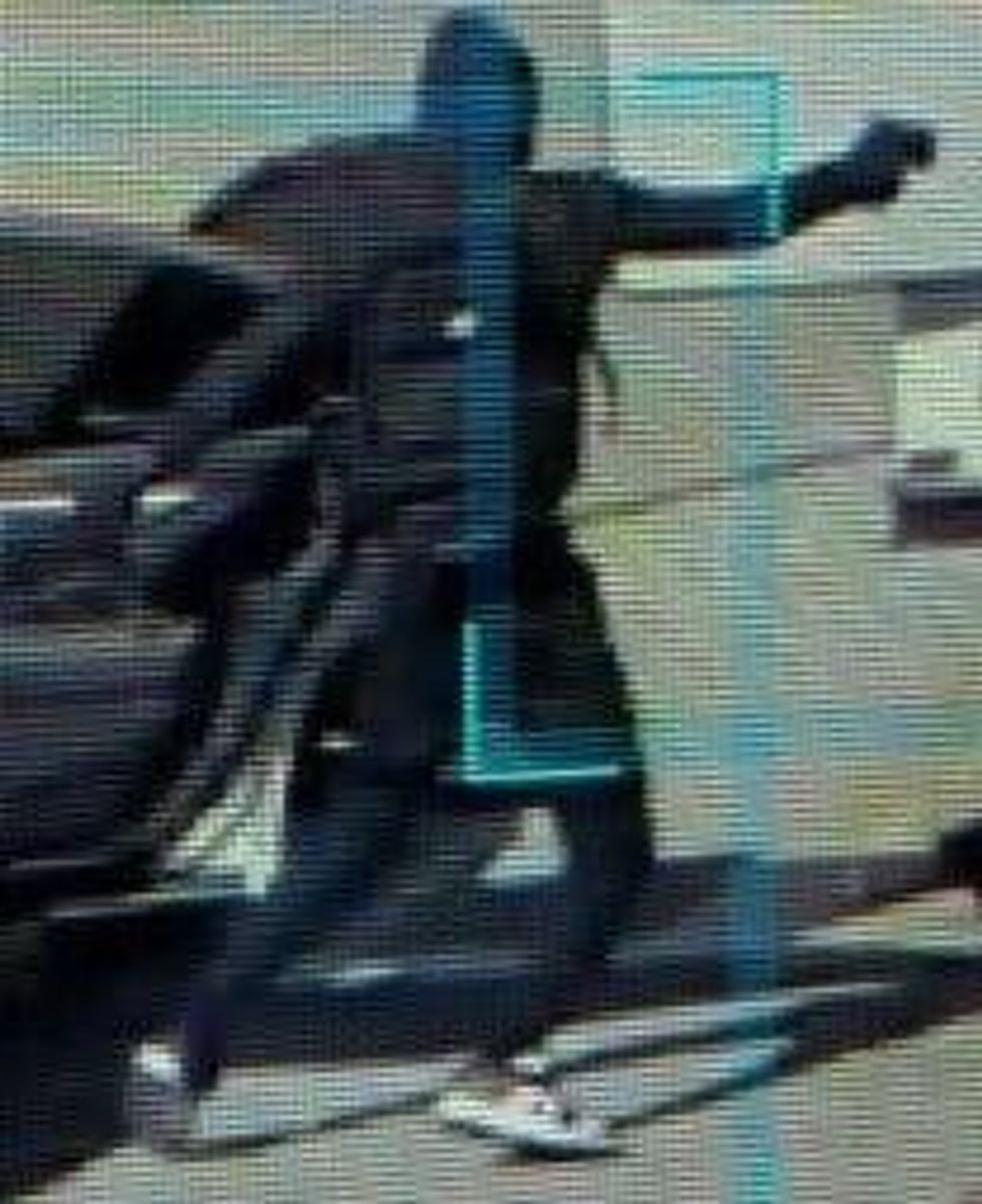 masked man with gun