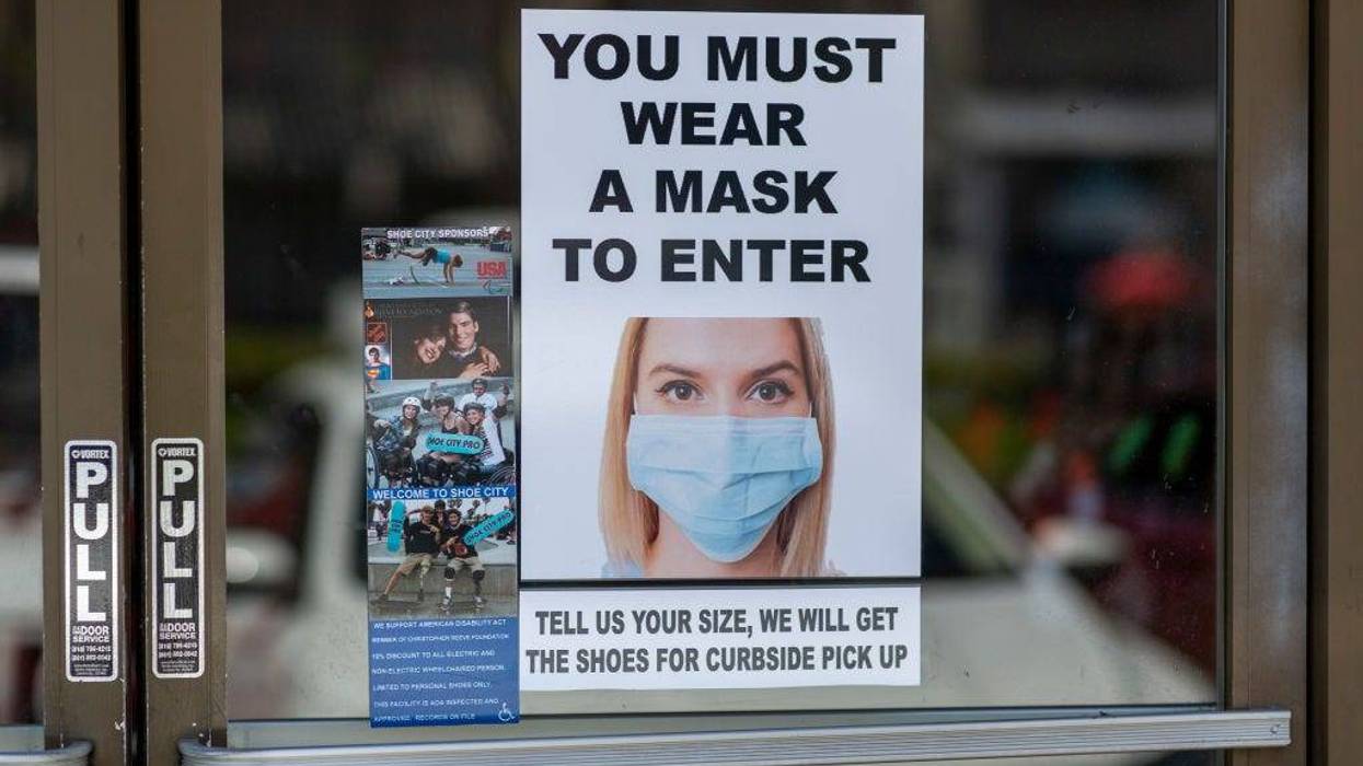 Masks are required for entry to a Shoe City store as Los Angeles County retail businesses reopen while the COVID-19 pandemic continues on May 27, 2020 in Glendale, California.