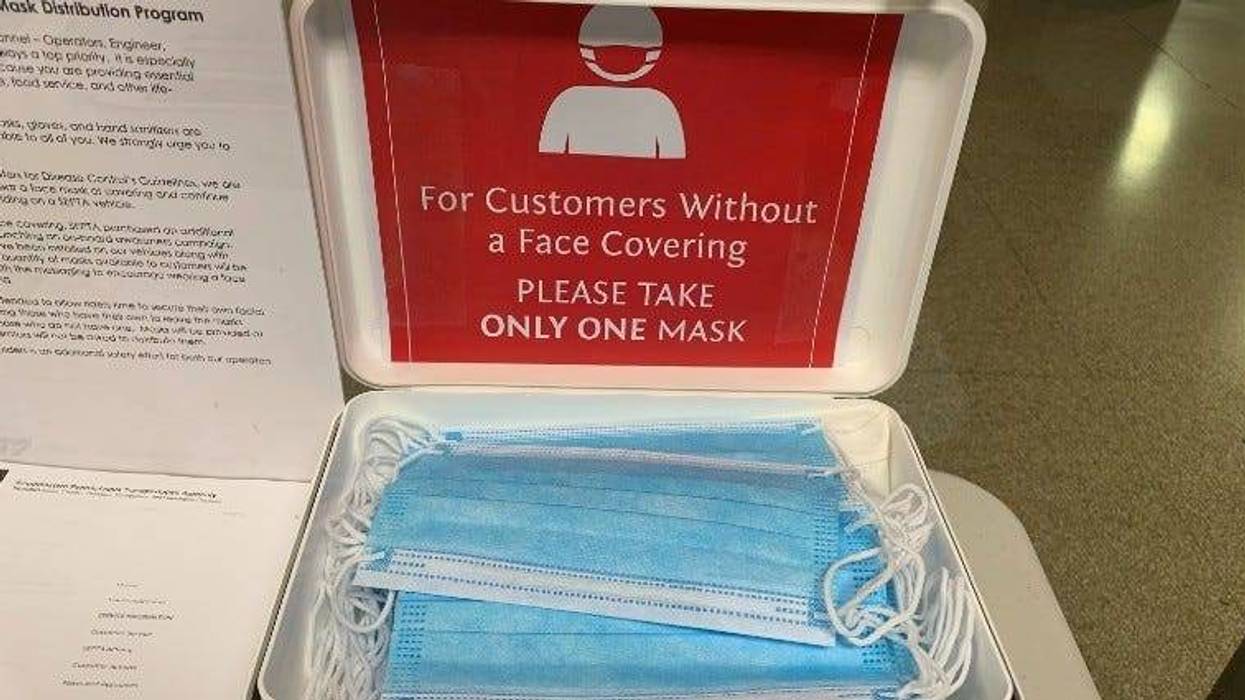 Masks offered for SEPTA riders at Suburban Station.
