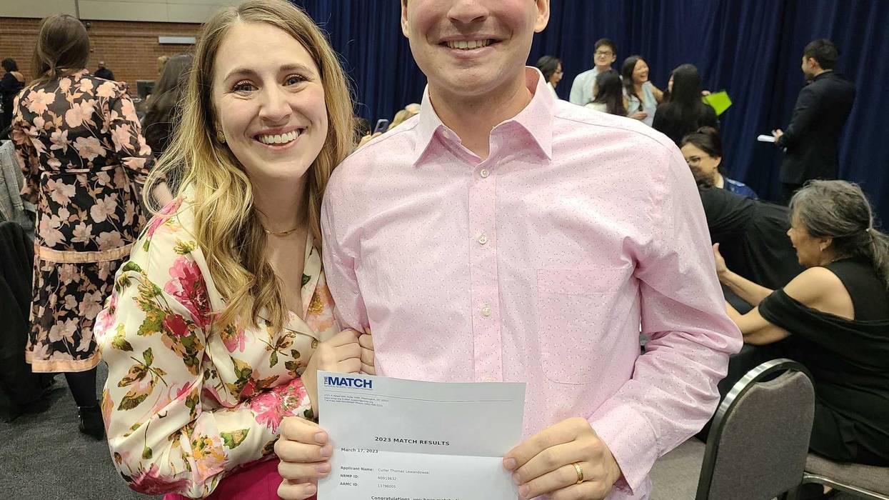 Match Day couple with letter