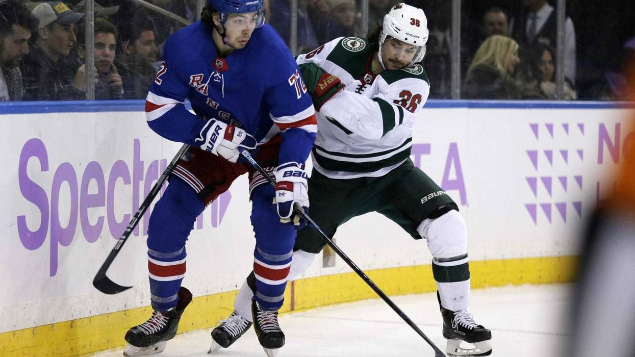 Mats Zuccarello and Filip Chytil and the puck