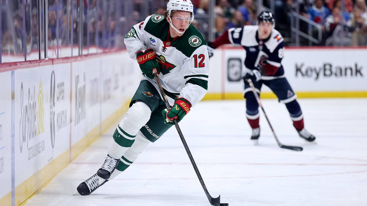 Matt Boldy #12 of the Minnesota Wild advances the puck against the Colorado Avalanche at Ball Arena on February 26, 2026 in Denver, Colorado.