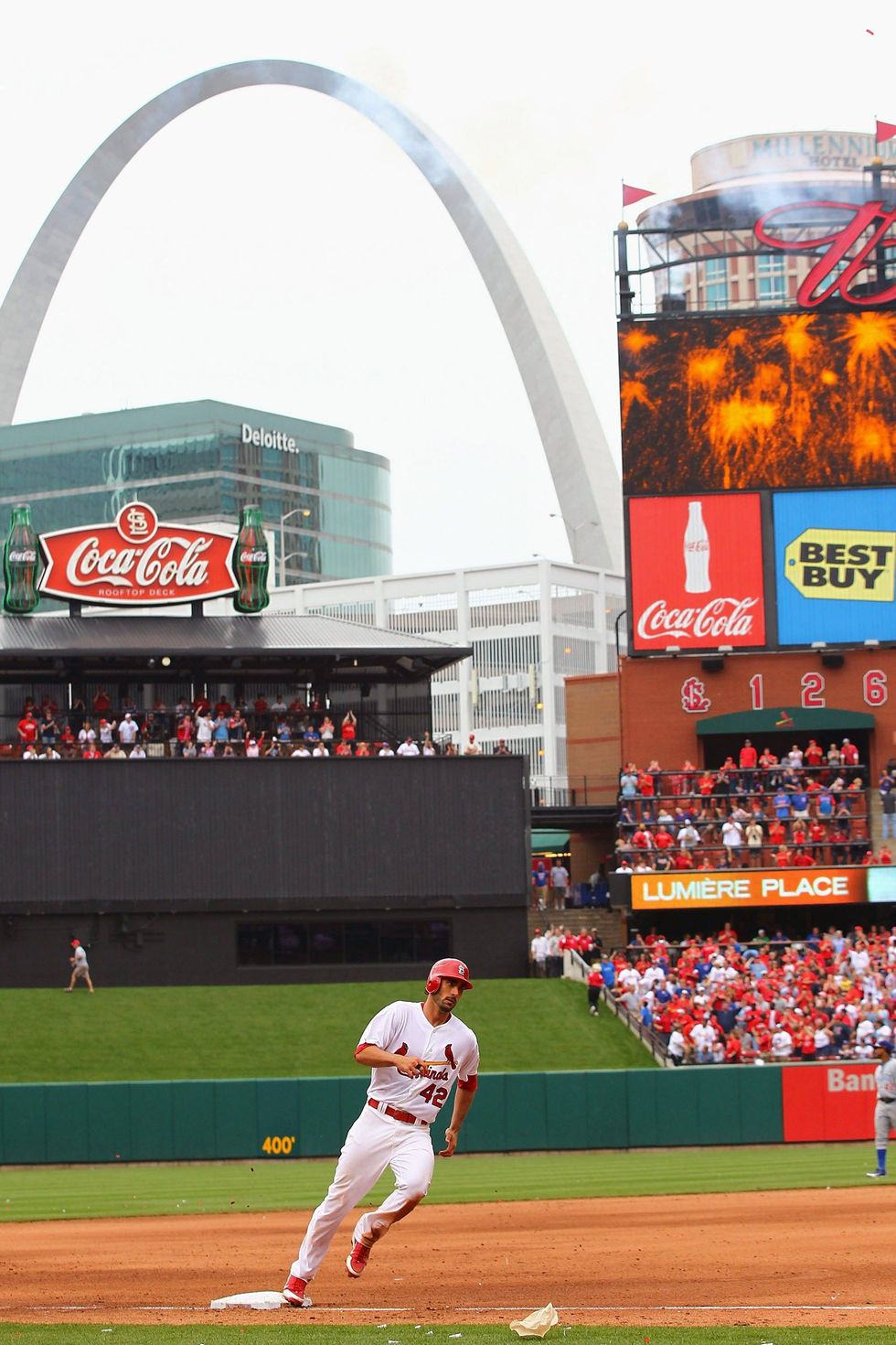 Matt Carpenter of the St. Louis Cardinals hits a two-run home run against the Chicago Cubs at Busch Stadium on April 15, 2012 in St. Louis, Missouri. Both teams wore the number 42 in honor of Jackie Robinson Day. The Cardinals beat the Cubs 10-3.