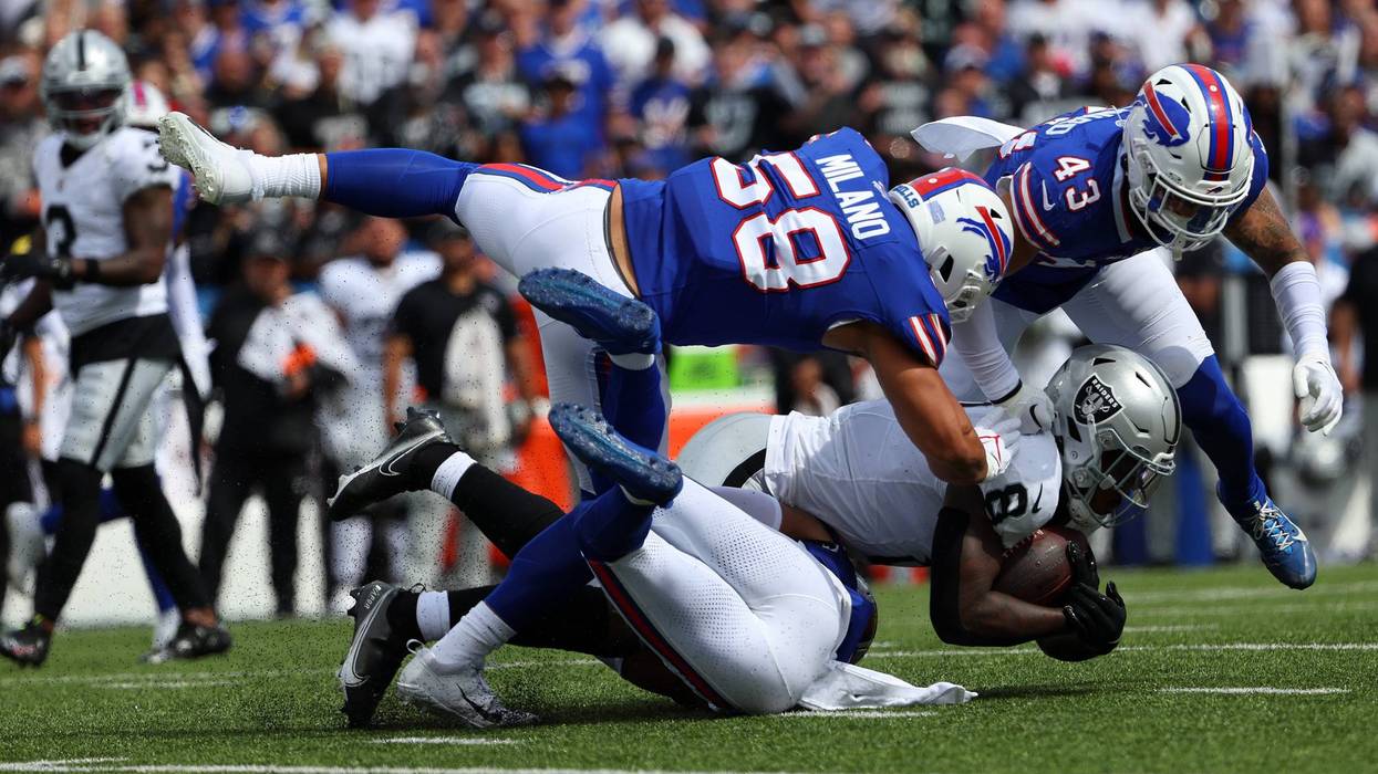 Matt Milano #58 of the Buffalo Bills and Terrel Bernard #43 of the Buffalo Bills tackle Josh Jacobs #8 of the Las Vegas Raiders during the second quarter at Highmark Stadium on September 17, 2023 in Orchard Park, New York.