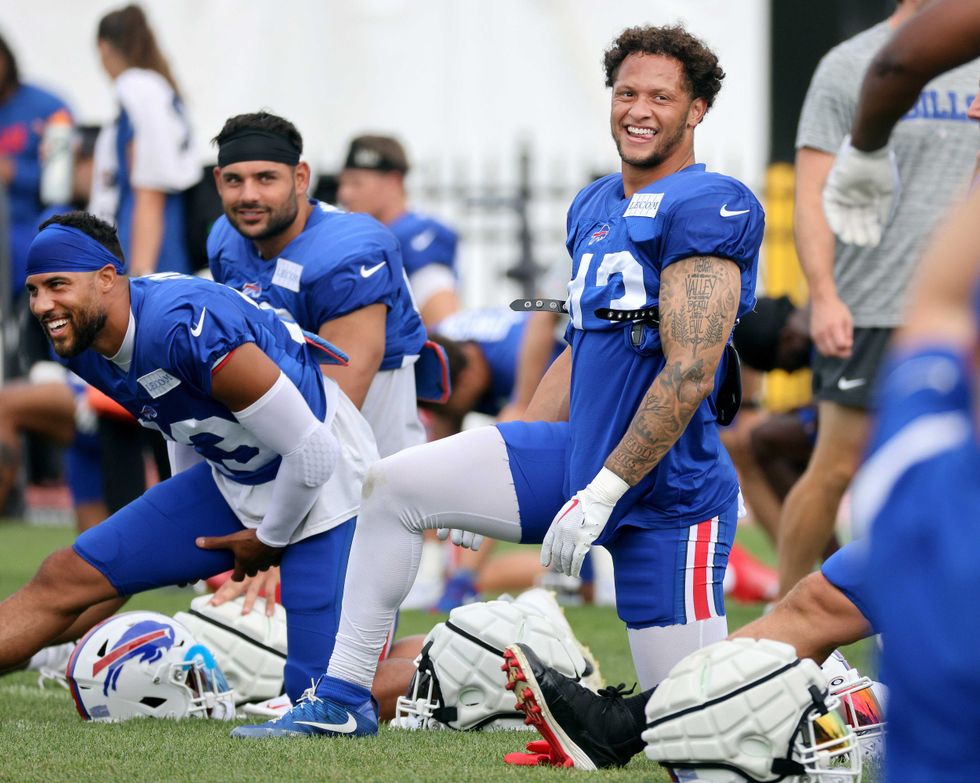 Matt Milano, Micah Hyde and Terrel Bernard