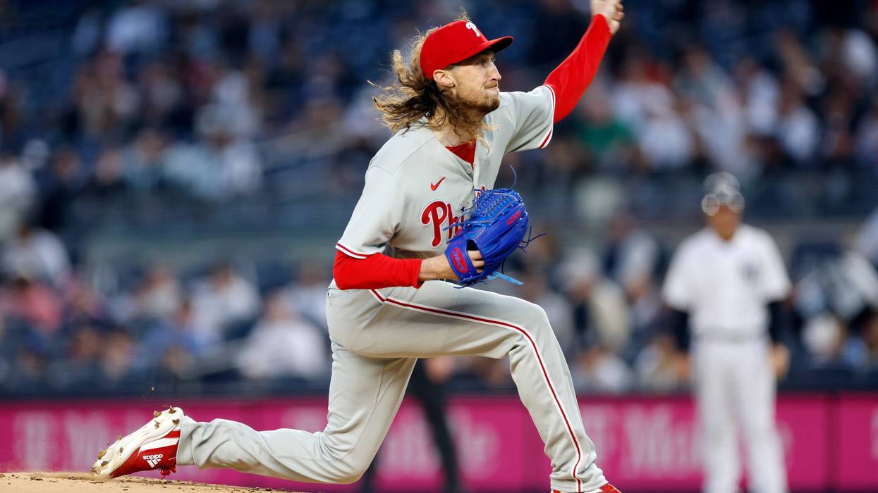 Matt Strahm #25 of the Philadelphia Phillies on the pitcher's mound, mid-pitch