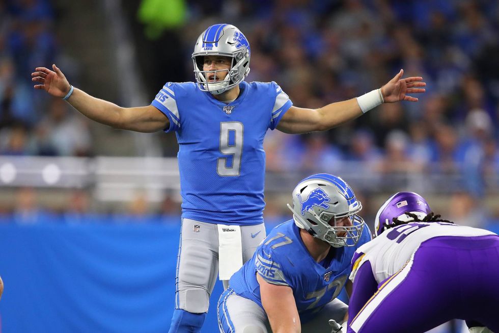 Matthew Stafford commands the huddle against the division-rival Vikings