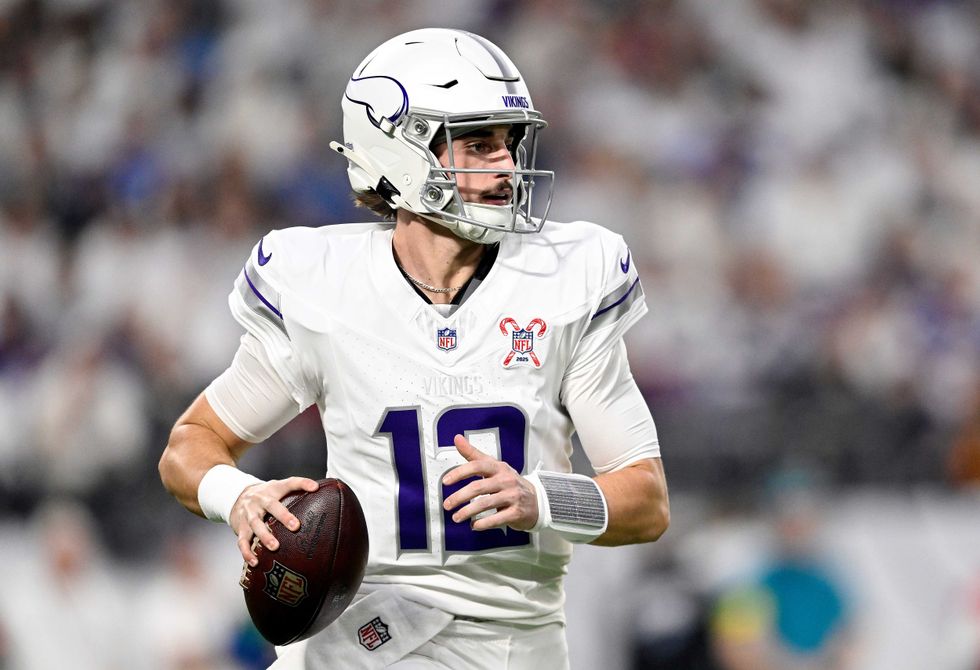 Max Brosmer #12 of the Minnesota Vikings looks to pass against the Detroit Lions during the first quarter at U.S. Bank Stadium on December 25, 2025 in Minneapolis, Minnesota.