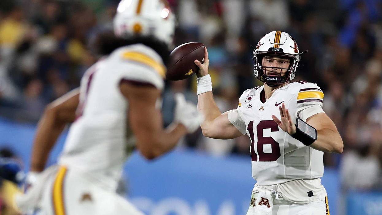 Max Brosmer #16 of the Minnesota Golden Gophers looks to pass the ball during the first half of a game against the UCLA Bruins at Rose Bowl on October 12, 2024 in Pasadena, California.