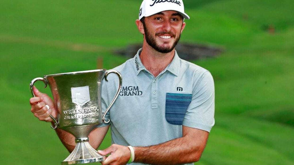 Max Homa poses with the trophy after winning the Wells Fargo Championship golf tournament at Quail Hollow Club in Charlotte, N.C., Sunday, May 5, 2019.