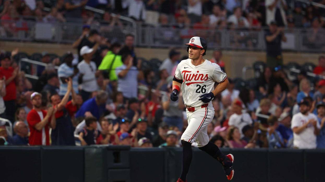 Max Kepler #26 of the Minnesota Twins rounds the bases on his three-run home run in the sixth inning against the Kansas City Royals at Target Field on August 13, 2024 in Minneapolis, Minnesota.