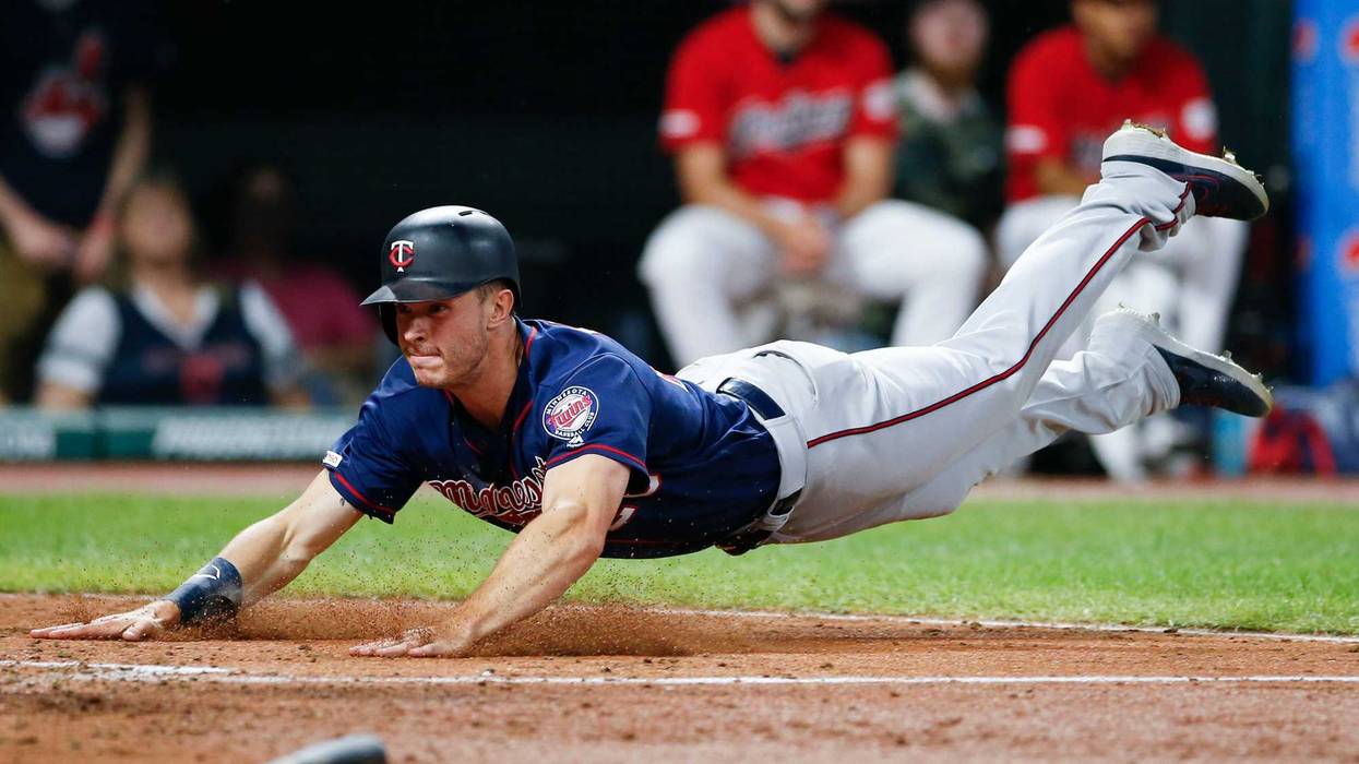 Max Kepler dives for the go-ahead run