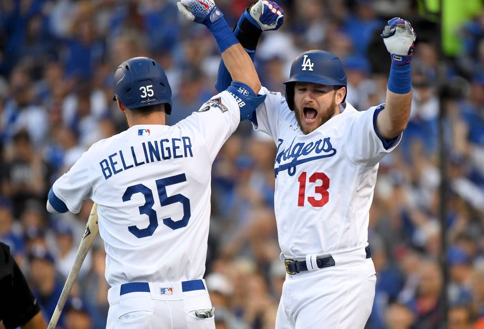 Max Muncy celebrates with Dodgers teammate Cody Bellinger