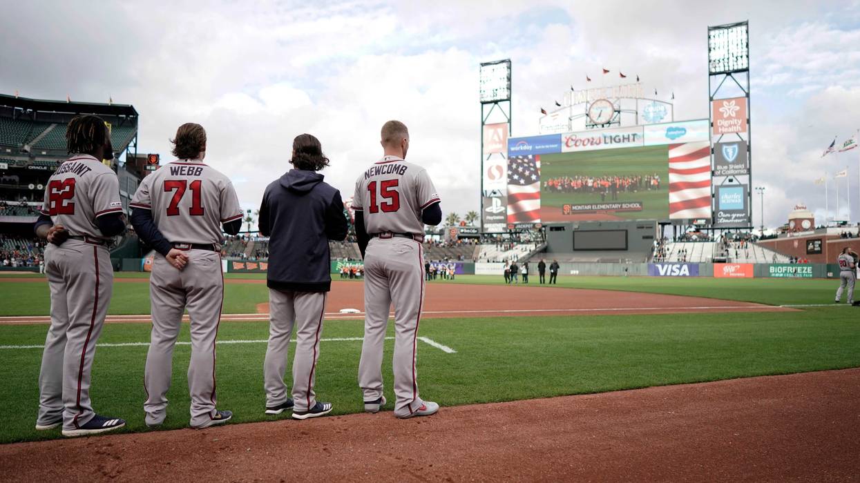 May 20, 2019; San Francisco, CA, USA; Atlanta Braves starting pitcher Touki Toussaint (62) and relief pitcher Jacob Webb ()71 and shortstop Charlie Culberson (second from right) and starting pitcher Sean Newcomb (15) stand for the National Anthem before a