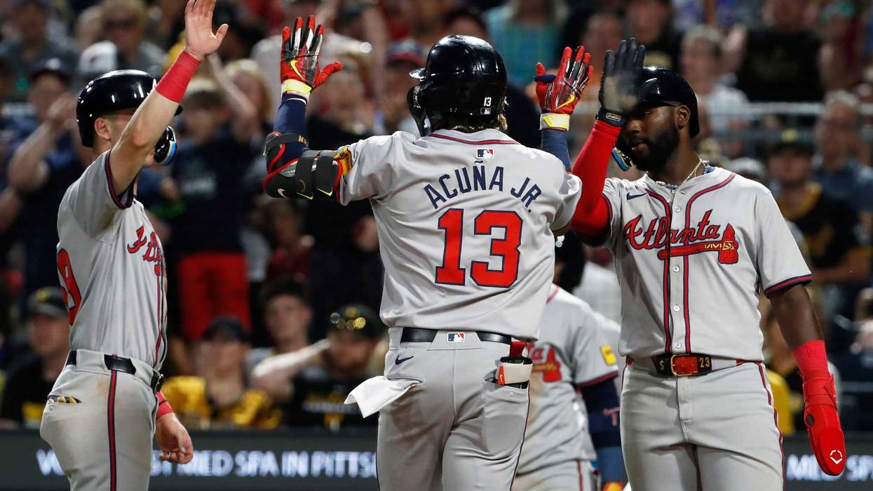 May 24, 2024; Pittsburgh, Pennsylvania, USA; Atlanta Braves third baseman Zack Short (left) and Atlanta center fielder Michael Harris II (right) congratulate right fielder Ronald Acuna Jr. (13) crossing home plate on a three-run home run against the Pittsburgh Pirates during the eighth inning at PNC Park. Mandatory Credit: Charles LeClaire-USA TODAY Sports